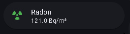 Compact kitchen-tablet Radon indicator with a green radiation icon and a reading in Bq/m³.